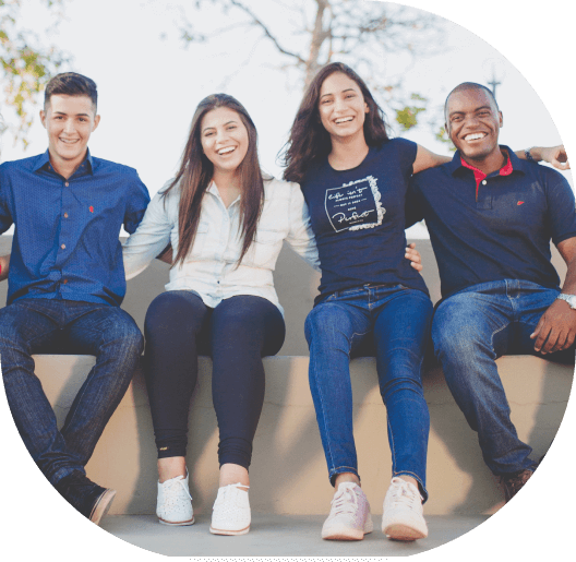 A group of people sitting on top of steps.