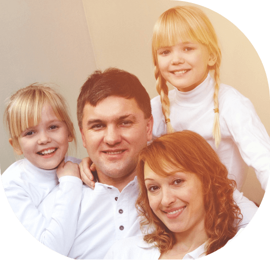 A family of four posing for the camera.