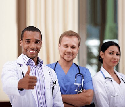 A group of doctors and nurses standing next to each other.